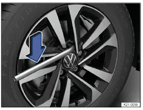 Volkswagen ID.3. Fig. 1 Loosening wheel bolts.