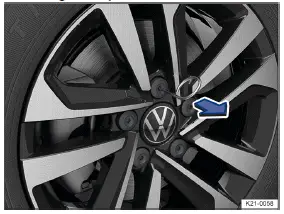 Volkswagen ID.3. Fig. 1 Remove the caps from the wheel bolts.